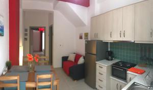 A kitchen or kitchenette at Mirtos Apartments