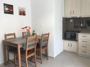 A kitchen or kitchenette at Mirtos Apartments