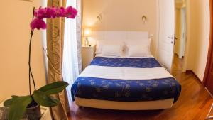 Postel nebo postele na pokoji v ubytování Hotel Martino Ai Monti