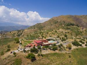 an aerial view of a house on a mountain at Casale Di Caterina in Taormina