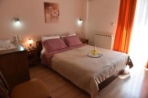 Postel nebo postele na pokoji v ubytování 40 Platania Hotel