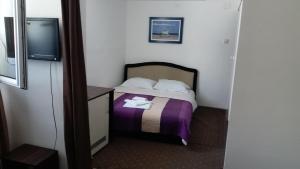 Llit o llits en una habitació de Gros Hotel - Leskovac