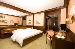Ein Bett oder Betten in einem Zimmer der Unterkunft Insel-Hotel Heilbronn