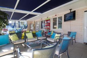 a group of chairs and tables on a patio at Azureva Pornichet Baie de La Baule in Pornichet