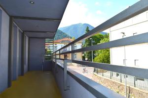 a balcony of a building with a view of a mountain at Hiša 2 in Tolmin