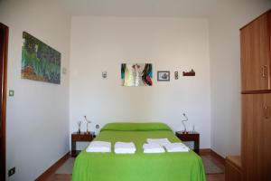 Cama ou camas em um quarto em Appartamento Rosa