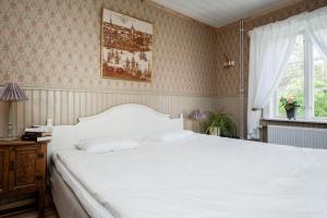 Postel nebo postele na pokoji v ubytování Enångers Bed and Breakfast