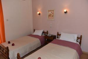 Ένα ή περισσότερα κρεβάτια σε δωμάτιο στο 40 Platania Hotel