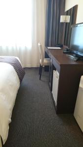 Postel nebo postele na pokoji v ubytování Hotel Ascent Plaza Hamamatsu