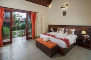Postel nebo postele na pokoji v ubytování Pondok Massas Ubud + 37 fotografií