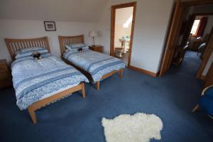 Postel nebo postele na pokoji v ubytování Bluebell Croft