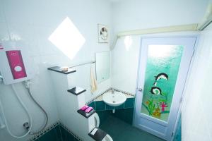 a small bathroom with a sink and a toilet at HappyLove1 in Ko Larn +47 photos