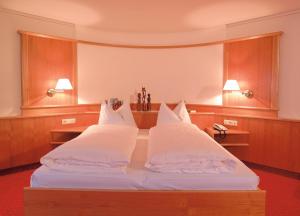Postel nebo postele na pokoji v ubytování Hotel Central