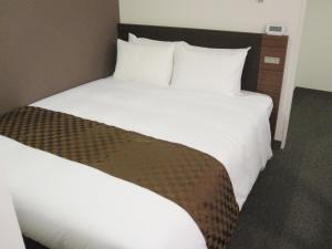 Postel nebo postele na pokoji v ubytování Hotel Ascent Plaza Hamamatsu