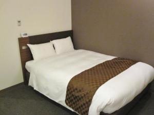 Postel nebo postele na pokoji v ubytování Hotel Ascent Plaza Hamamatsu