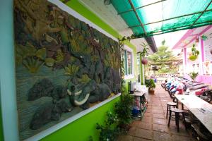 a wall of a restaurant with a painting on it at HappyLove1 in Ko Larn