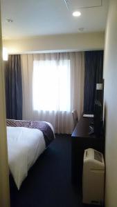 Postel nebo postele na pokoji v ubytování Hotel Ascent Plaza Hamamatsu