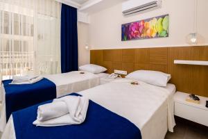 Postel nebo postele na pokoji v ubytování Kaş Artemis Hotel