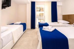 Postel nebo postele na pokoji v ubytování Kaş Artemis Hotel