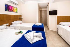 Postel nebo postele na pokoji v ubytování Kaş Artemis Hotel