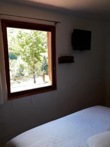 TV a/nebo společenská místnost v ubytování El Solei Paraiso en el Montseny