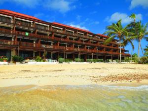 a hotel on the beach next to the ocean at Luxury Beachfront Duplex Villa on Sapphire Beach V in St Thomas