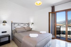 Posteľ alebo postele v izbe v ubytovaní Hotel Montmar