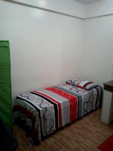 Letto o letti in una camera di Budget Studio Unit in Makati