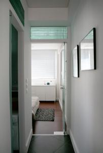 a hallway with a room with a bed and a window at Mind-blowing Acropolis View Apt in Athens