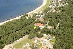an aerial view of a house next to a beach at Bel Air Strandhotel Glowe in Glowe