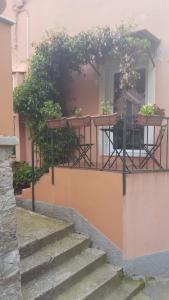 a balcony with a table and chairs on a house at Affittacamere Da Cesare in Monterosso al Mare