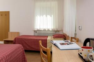 Postel nebo postele na pokoji v ubytování Garni Ciamorc