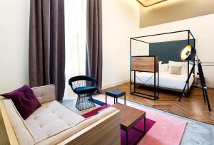 a living room with a couch and a bed at One Shot Tabakalera House in Donostia-San Sebastián +37 photos