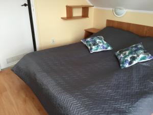 Ένα ή περισσότερα κρεβάτια σε δωμάτιο στο Willa Korweta