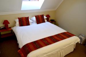 Кровать или кровати в номере iKhaya Lodge
