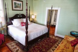 a bedroom with a large bed in a room at Beachview Inn and Spa in Tybee Island