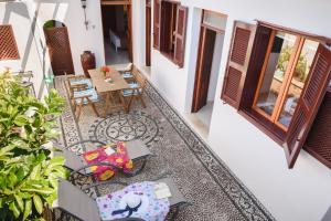 A seating area at Thea Villas and Suite