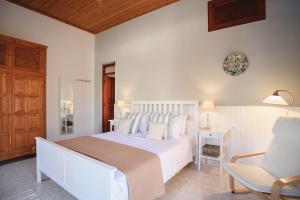 A bed or beds in a room at Thea Villas and Suite