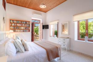 A television and/or entertainment centre at Thea Villas and Suite