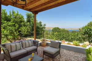 A balcony or terrace at Thea Villas and Suite