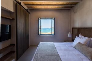 Cama ou camas em um quarto em Branco Mykonos