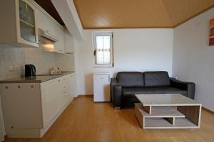 a living room with a couch and a table at Apartment Vucic in Makarska