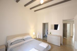 מיטה או מיטות בחדר ב-B&B Corso Italia 58