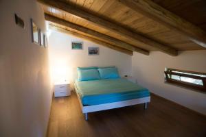 Postel nebo postele na pokoji v ubytování Residenza Lombardi