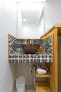 a bathroom with a copper sink on a counter at Kyotoya Tsukinoyu Kukai in Kyoto