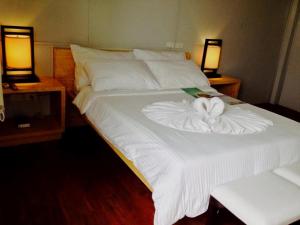 Una cama o camas en una habitación de Shore Time Hotel - Annex