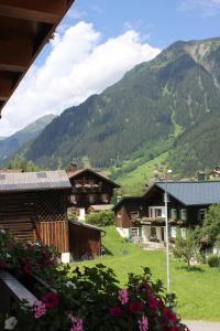 a view of a village with mountains in the background at Ferienwohnungen Franz Pfeifer / Beatrice Roduner in Gaschurn