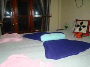 Postel nebo postele na pokoji v ubytování Serenity Homestay