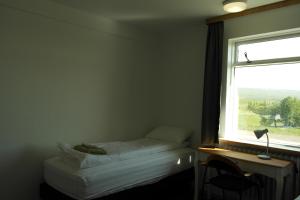Katil atau katil-katil dalam bilik di Eidavellir Apartments and Rooms