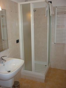 a bathroom with a shower and a sink at Affittacamere B&B Trattoria della Posta in Maissana +58 photos